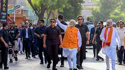 Prime Minister Narendra Modi leaves after casting his vote at a polling station during the third phase of Lok Sabha elections, in Ahmedabad.