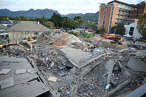 The scene of a collapsed building in George, South Africa, Tuesday, May 7, 2024. Five workers have been killed with 49 still trapped after the building under construction collapsed Monday.