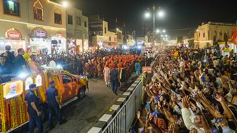 Prime Minister Narendra Modi with Uttar Pradesh Chief Minister Yogi Adityanath during a roadshow for Lok Sabha elections, in Ayodhya.