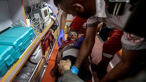 Palestinian medics evacuate a wounded boy in Israeli bombardment of the Gaza Strip by ambulance to the Hospital in Rafah, southern Gaza Strip.