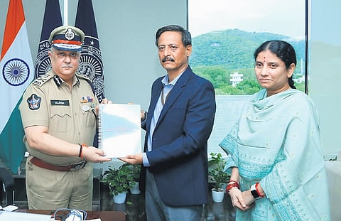 Special Investigation Team chief Vineet Brijlal submits the report on poll violence to DGP Harish Kumar Gupta in Vijayawada on Monday