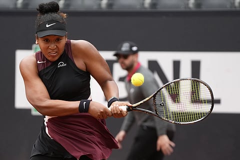 Japan's Naomi Osaka returns the ball to France's Clara Borel during their match at the Italian Open tennis tournament in Rome, Wednesday, May 8, 2024.