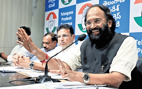 IT Minister D Sridhar Babu looks on as Irrigation Minister Uttam Kumar Reddy speaks to the media in Hyderabad on Sunday