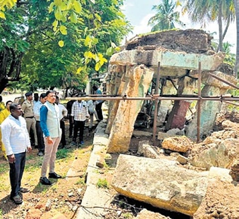 Deputy Commissioner M S Divakar inspects the damage to the monument in Hampi on Wednesday