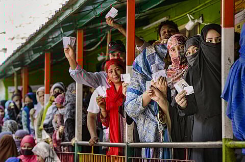 People waiting to cast their votes during the sixth phase of the Lok Sabha elections in East Delhi constituency.