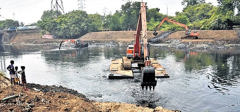 Desilting being undertaken as part of pre-monsoon preparedness measures in order to ensure free flow of rain water in Buckingham Canal near Basin Bridge