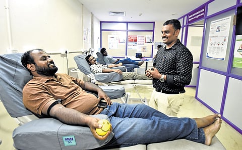 Volunteers from Annai Karangal Nala Sangam donating blood in Coimbatore