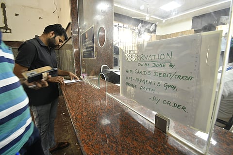 The announcement to book tickets using digital payments put up at the counter in Thanjavur railway junction