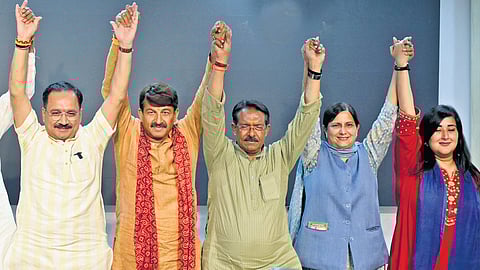 BJP Delhi chief Virendra Sachdeva with party candidates on Friday