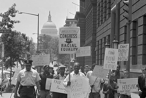 Demonstrators march down North Capital Street during protest march within sight of the capitol in Washington, June 14, 1963.