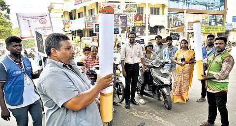 Staff of Zone 6, Greater Chennai Corporation, spreading awareness against tobacco among the public on Friday