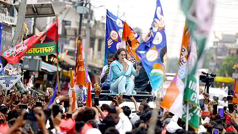 Congress General Secretary Priyanka Gandhi Vadra addresses the gathering during a roadshow for the Lok Sabha elections, in Rae Bareli.