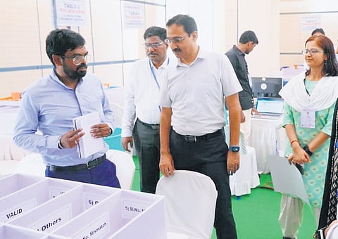 Chief Electoral Officer Mukesh Kumar Meena inspects the counting halls and strong rooms at Krishna University in Machilipatnam on Thursday