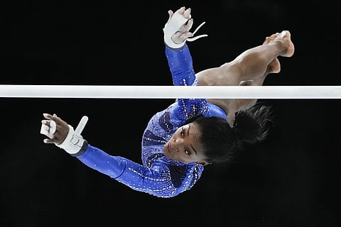 United States' Simone Biles competes on the uneven bars during the women's all round final at the Artistic Gymnastics World Championships in Antwerp, Belgium, Friday, Oct 6, 2023.
