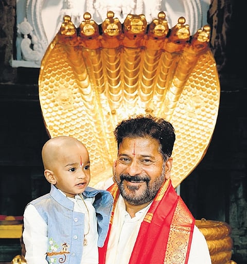 Revanth Reddy with his grandson at the Srivari temple in Tirumala