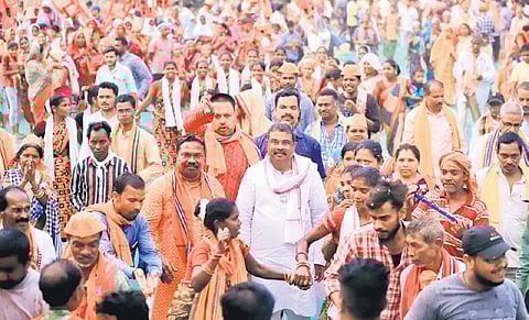 Dharmendra Pradhan, Union Minister and BJP Lok Sabha candidate from Sambalpur flanked by supporters at a public meeting in Kuchinda