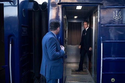 U.S. Secretary of State Antony Blinken, right, arrives by train at Kyiv-Pasazhyrskyi station.