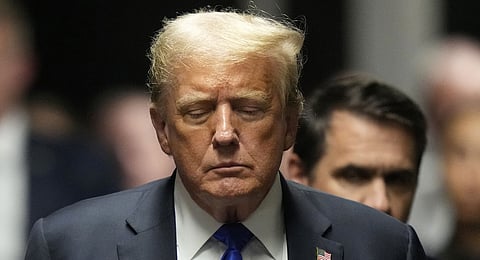 Former US President Donald Trump walks to make comments to members of the media after a jury convicted him of felony crimes for falsifying business records in a scheme to illegally influence the 2016 election, at Manhattan Criminal Court, Thursday, May 30, 2024, in New York.