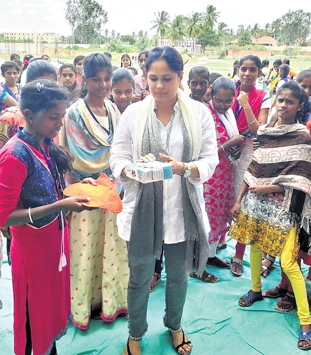 Anitha Rao explains the function of reusable pads and menstrual cups to girls, in one of her workshops
