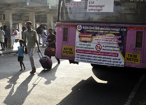 The ad on the rear of a government bus that runs on route 65A from Sulur to Gandhipuram.