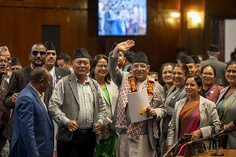 Nepalese Prime Minister Pushpa Kamal Dahal waves to media after winning a vote of confidence in parliament in Kathmandu, Nepal, Monday, May 20, 2024.