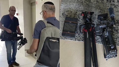In this image from video, Israeli officials seize AP video equipment from an apartment block in Sderot, Southern Israel, Tuesday, May 21, 2024.