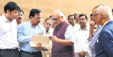 Justice PC Ghose interacts with officials during his visit to Medigadda on Tuesday