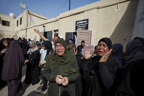 Palestinians mourn their relatives who were killed in an Israeli airstrike in Nuseirat, at the Al Aqsa hospital in Deir al Balah, Gaza Strip, Sunday, May 19, 2024.
