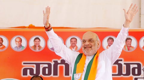 Union Home Minister Amit Shah waves to the crowd at a public meeting in Nagarkurnool on Saturday.