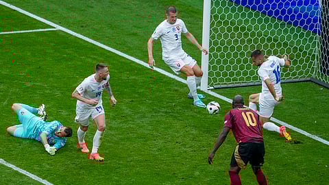 Slovakia's David Hancko, right, blocks a shot by Belgium's Johan Bakayoko during the Group E match between Belgium and Slovakia at the Euro 2024 soccer tournament in Frankfurt, Germany, Monday, June 17, 2024.