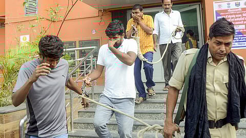 Economic Offences Unit personnel leave with the accused arrested in connection with the alleged irregularities in NEET-UG exams 2024.