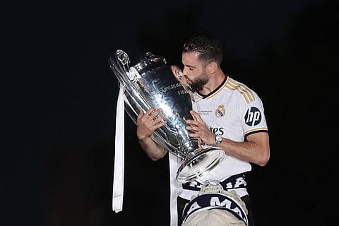 Real Madrid defender Nacho Fernandez celebrates with the trophy their 15th Champions League win in Madrid