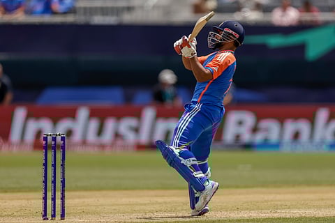 India's Rishabh Pant plays a reverse shot for six runs to seal the victory by 8 wickets against Ireland during an ICC Men's T20 World Cup cricket match at the Nassau County International Cricket Stadium in Westbury, New York