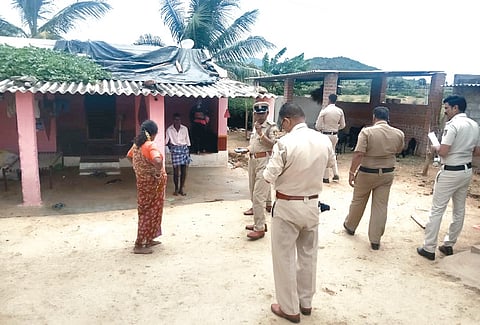 Excise and police personnel at a village on Karnataka-Tamil Nadu border.