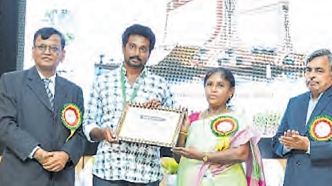 J Sanjeeva Reddy receiving an award from ANGRAU V-C on Wednesday