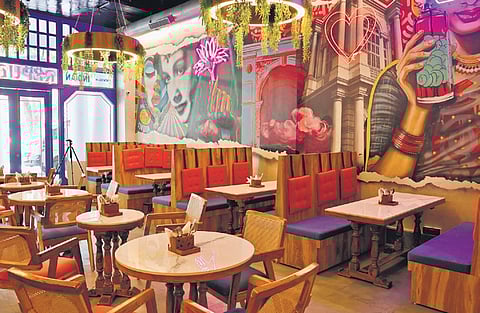 Ambience with retro wall art in Delhi's new Indian Republic Canteen.