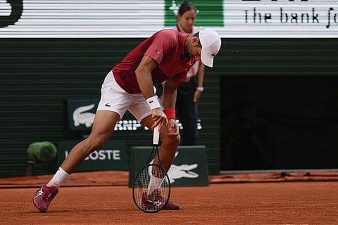 Serbia's Novak Djokovic reacts after missing a shot against Argentina's Francisco Cerundolo during their fourth round match of the French Open tennis tournament at the Roland Garros in Paris, Monday, June 3, 2024.