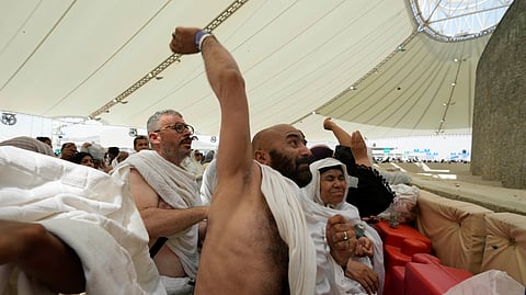 Muslim pilgrims cast stones at pillars in the symbolic stoning of the devil, the last rite of the annual hajj, in Mina, near the holy city of Mecca, Saudi Arabia, Sunday, June 16, 2024.