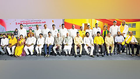 Prime Minister Narendra Modi poses for a photograph with Governor S Abdul Nazeer, Chief Minister Nara Chandrababu Naidu and his Cabinet colleagues after the swearing-in ceremony at Kesarapalli near Gannavaram in Krishna district on Wednesday