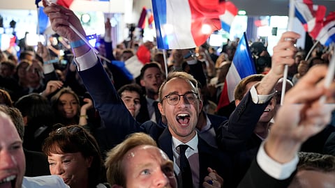 Supporters of French far-right National Rally react at the party election night headquarters, Sunday, June 9, 2024 in Paris.