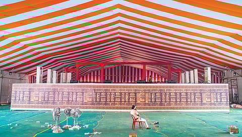 A cop guards the stage at Janata Maidan in Bhubaneswar as the swearing-in ceremony of the new state government was postponed to June 12