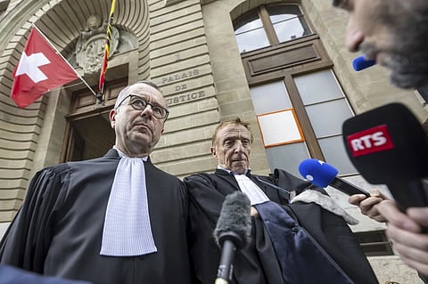 Lawyers of the accused, Nicolas Jeandin, left, and Robert Assael, right, leave the court house after a break in the reading of the verdict, during the trial against members of the billionaire Hinduja family, in Geneva, Switzerland, Friday June 21, 2024.
