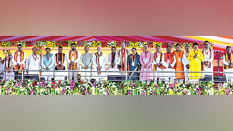 PM Narendra Modi and Governor Raghubar Das pose with Chief Minister Mohan Charan Majhi, Dy CMs KV Singh Deo, Pravati Parida and ministers after the oath taking ceremony in Bhubaneswar on Wednesday