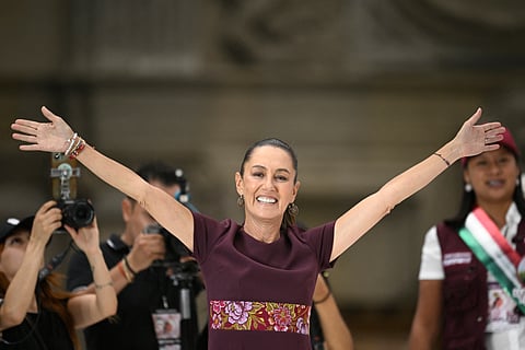 Mexico's presidential candidate for the ruling Morena party Claudia Sheinbaum greets supporters as she arrives for her campaign closing rally, at the Zocalo square in Mexico City on May 29, 2024.