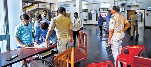 Authorised visitors register themselves before entering the strong room ahead of vote counting at BJB Autonomous College in Bhubaneswar, on Monday