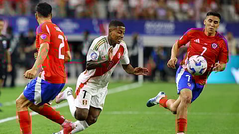 Peru's midfielder #07 Andy Polo fights for the ball with Chile's defender #02 Gabriel Suazo and Chile's midfielder #07 Marcelino Nunez during the Conmebol 2024 Copa America tournament group A football match between Peru and Chile on June 21, 2024.