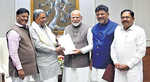 (Left) CM Siddaramaiah submits a memorandum to PM Narendra Modi, in New Delhi on Saturday. DyCM DK Shivakumar, Home Minister Dr G Parameshwara and Social Welfare Minister HC Mahadevappa look on. (Representational image)