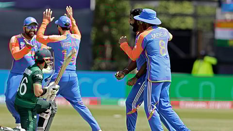 India's Jasprit Bumrah, second right, celebrates with teammates the dismissal of Pakistan's Mohammad Rizwan, left, on ground, during the ICC Men's T20 World Cup cricket match between India and Pakistan at the Nassau County International Cricket Stadium in Westbury, New York.
