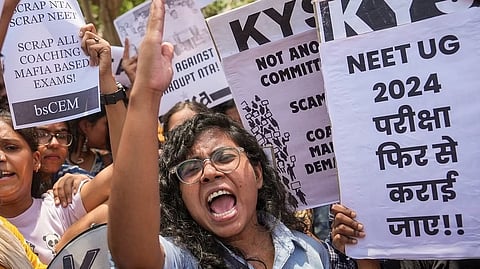 Members of various student organisations stage a protest against the alleged irregularities in the NEET-UG 2024 entrance exam result in New Delhi.