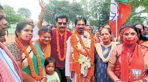 Padma Charan Haiburu of BJP celebrating his win from Karanjia Assembly constituency